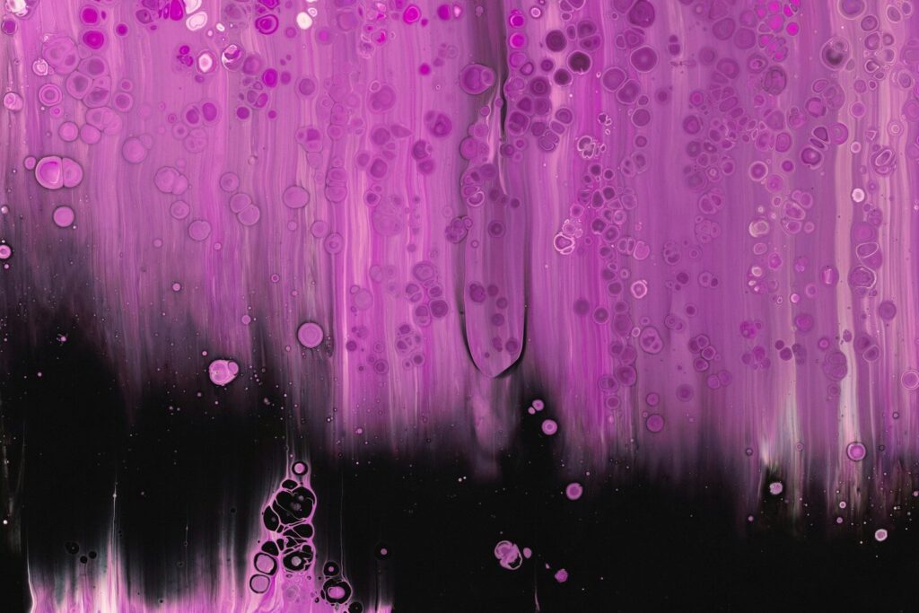 Abstract pink and black fluid art with bubbles